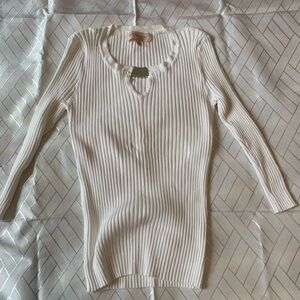 Crisp white knit sweater with silver trim. NWOT